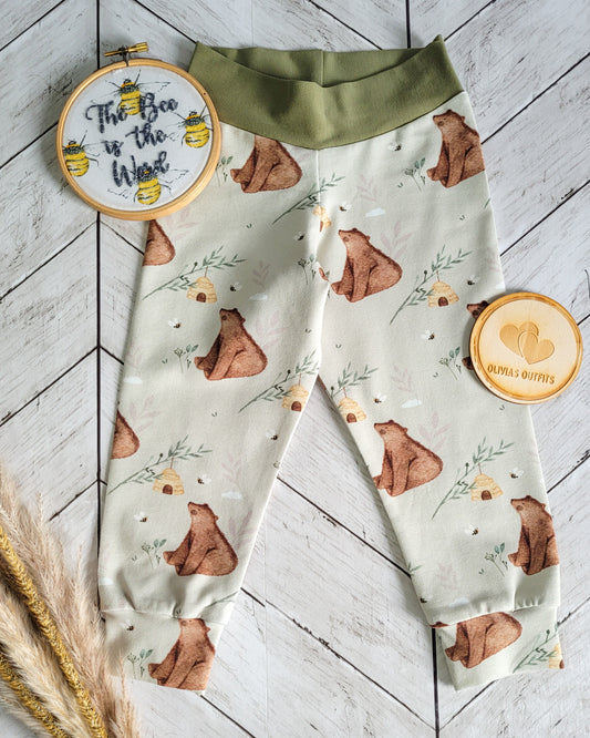 Handmade children's leggings with bear and beehive print, finished with yoga waistband and cuffs, styled flat with Olivia’s Outfits tag