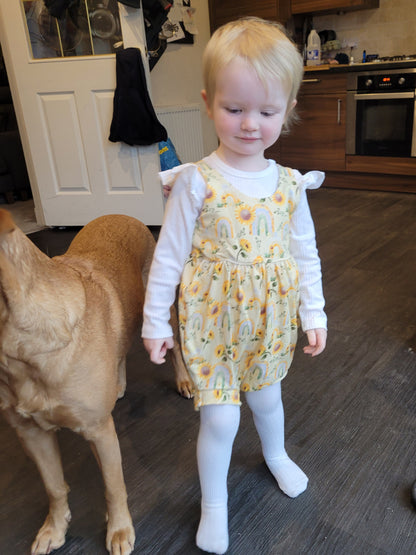 child wearing sinclair romper paired with thighs and a long sleeve bodysuit