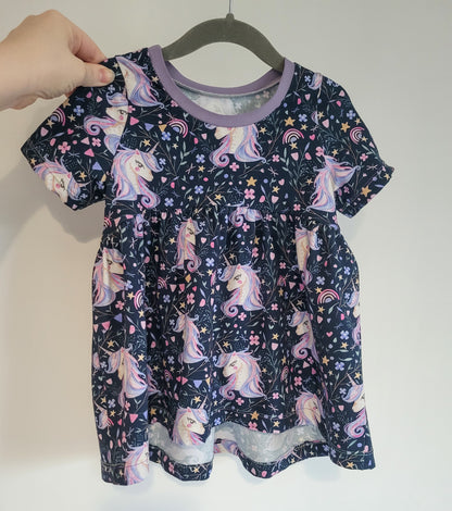 Unicorn print peplum top on hanger, handmade for children by Olivia’s Outfits